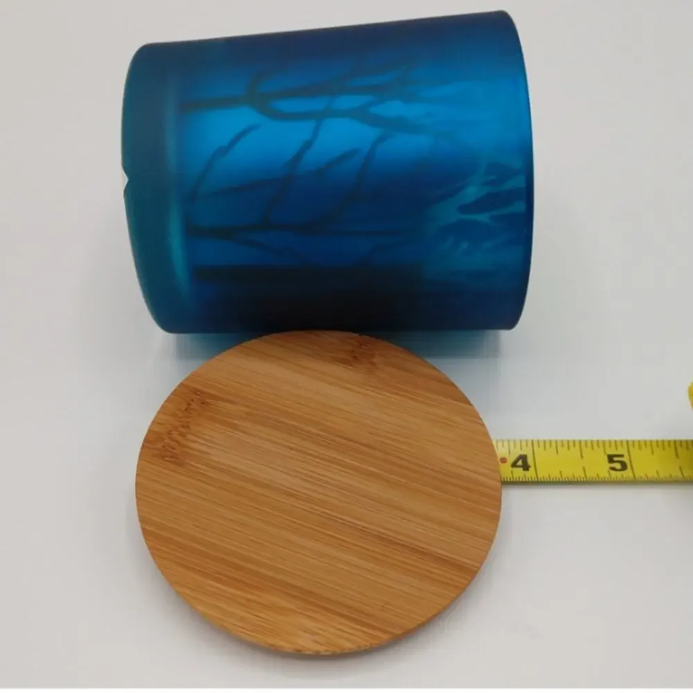 Elegant Blue Glass Candle with Tree Silhouettes